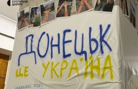 головна