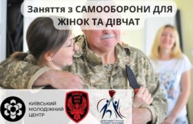 головна
